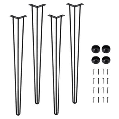 Set of four black metal U-shaped legs with flat rectangular bases, plus four black round caps, screws, and a wood surface demonstrating installation