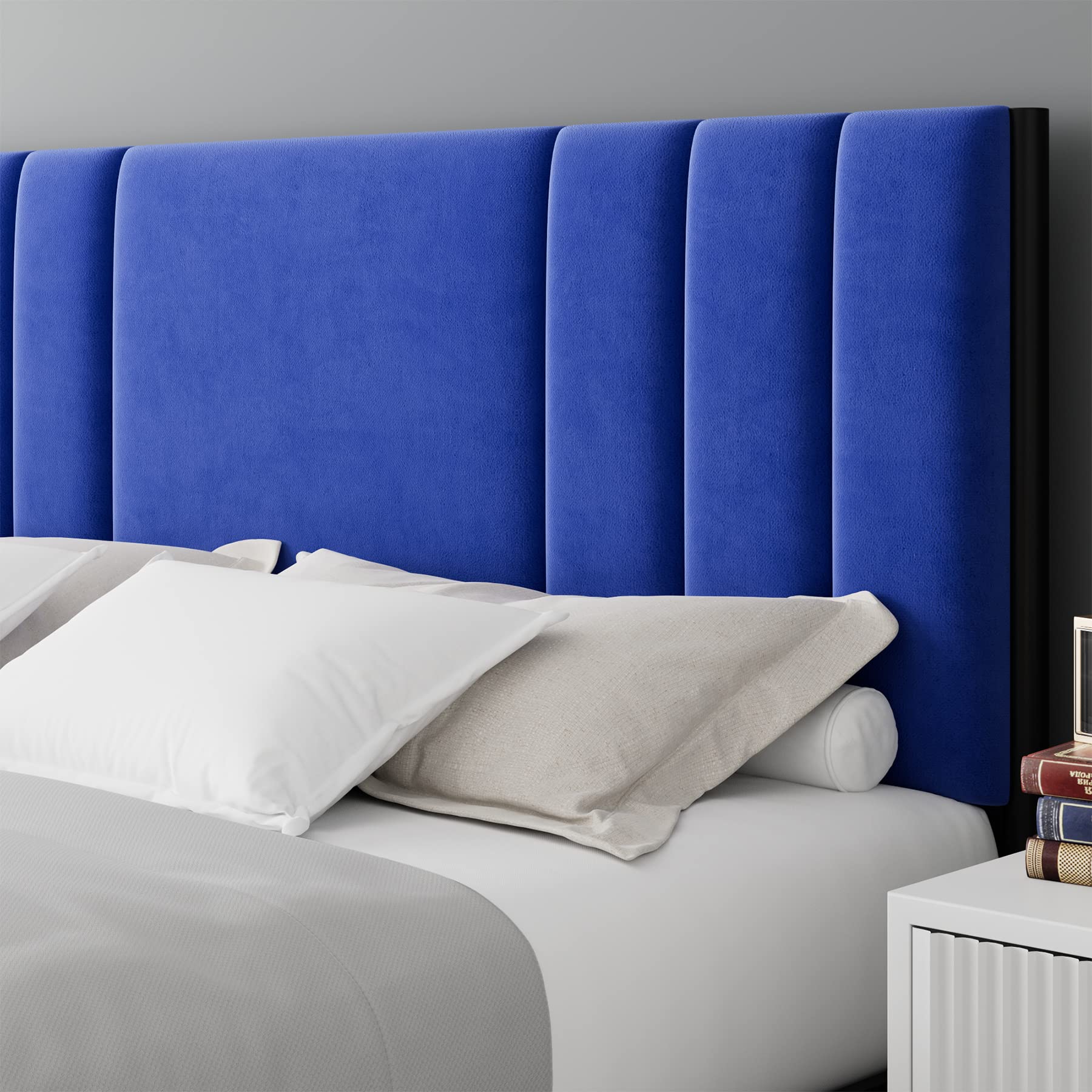 Royal blue upholstered king bed headboard close-up with vertical channels
