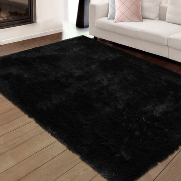 Modern black shag rug with plush texture, non-slip base, perfect for cozy spaces.