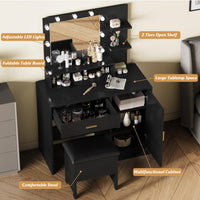 Black vanity table with drawers, shelves, and mirror, equipped with LED lights, set in a room with a bed and decorative items.