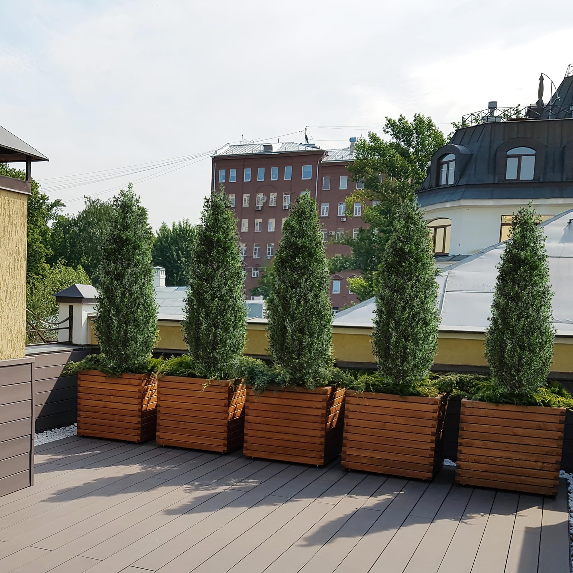 Artificial cedar topiary branches arranged to create a full green profile